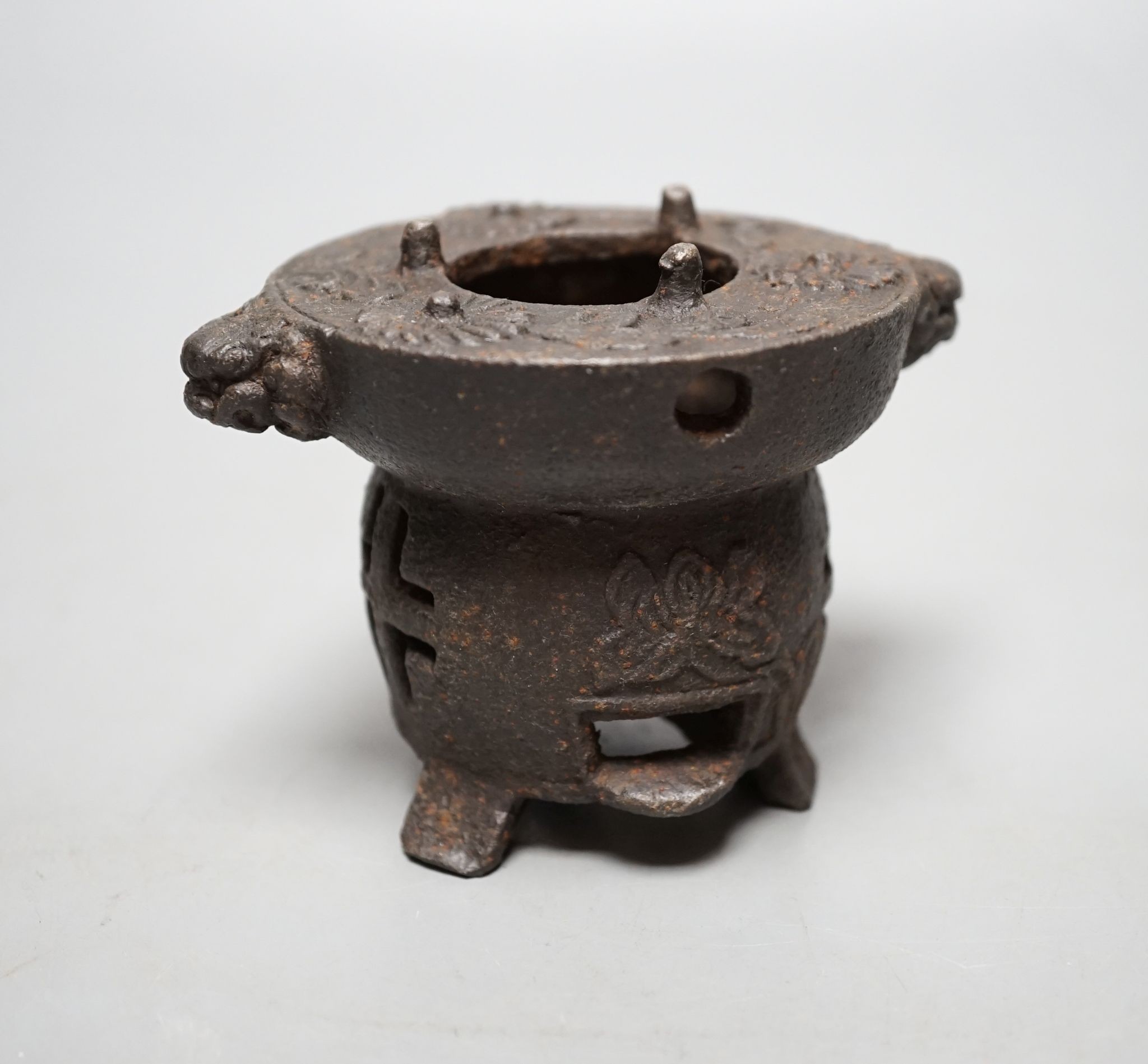 A Japanese cast iron burner stand, 6.5 cms high.